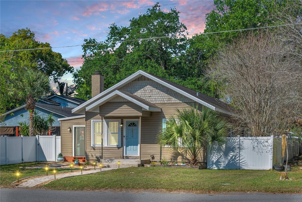 front view of a house with a yard