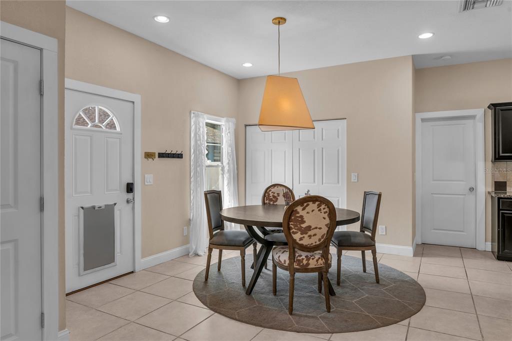 2414 Newberry Street Orlando, FL 32806 - Photo 11 of 36 a dining room with furniture and window