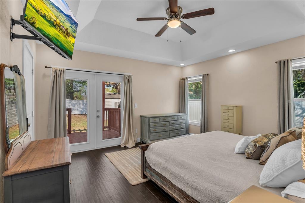 2414 Newberry Street Orlando, FL 32806 - Photo 15 of 36 a bedroom with a bed and a chandelier