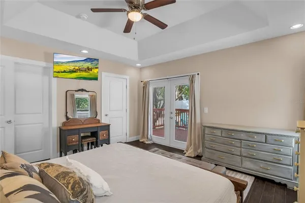 a bedroom with a bed and a dresser