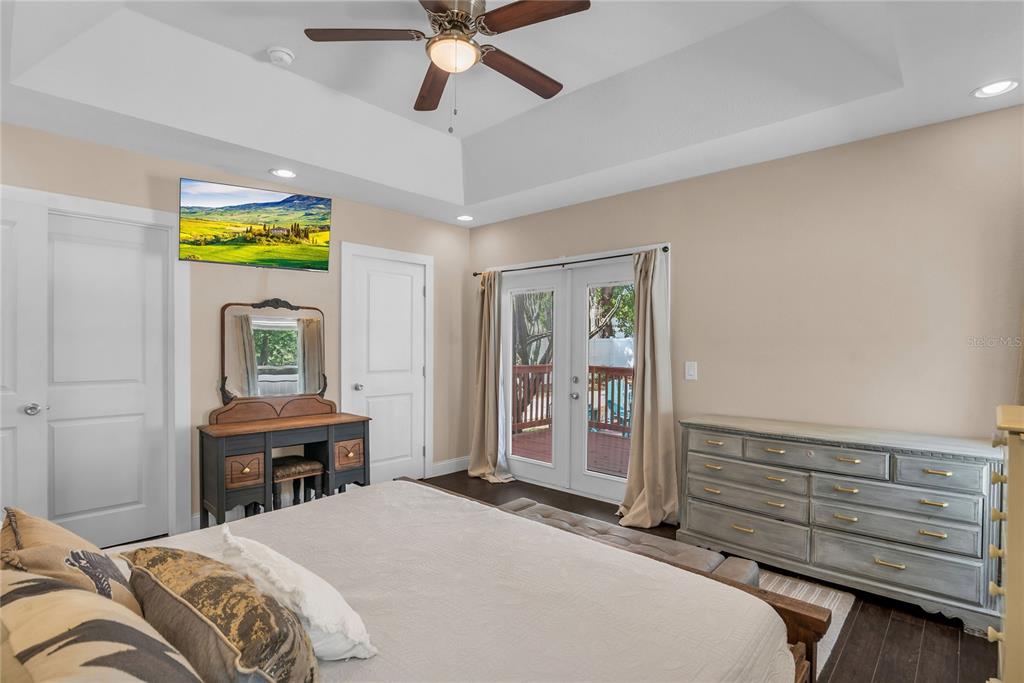 2414 Newberry Street Orlando, FL 32806 - Photo 16 of 36 a bedroom with a bed and a dresser