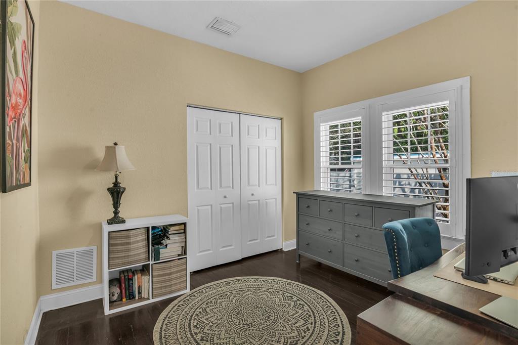 2414 Newberry Street Orlando, FL 32806 - Photo 22 of 36 a workspace with furniture and a window