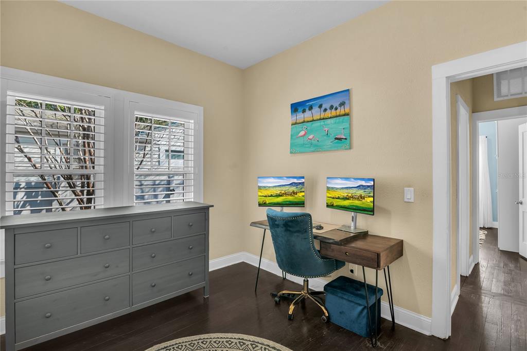 2414 Newberry Street Orlando, FL 32806 - Photo 23 of 36 a view of a workspace with furniture and a window