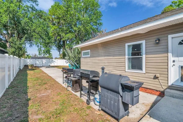 a view of backyard with sitting area