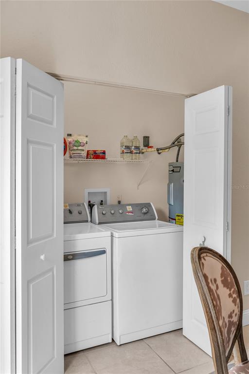 2414 Newberry Street Orlando, FL 32806 - Photo 35 of 36 a utility room with sink dryer and washer