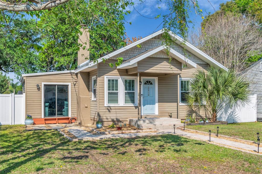 2414 Newberry Street Orlando, FL 32806 - Photo 6 of 36 a front view of a house with garden