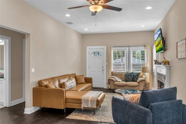 a living room with furniture and a large window