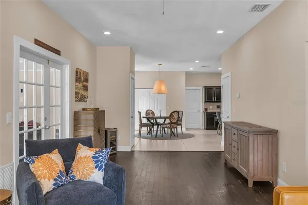 a living room with fireplace furniture and a large window