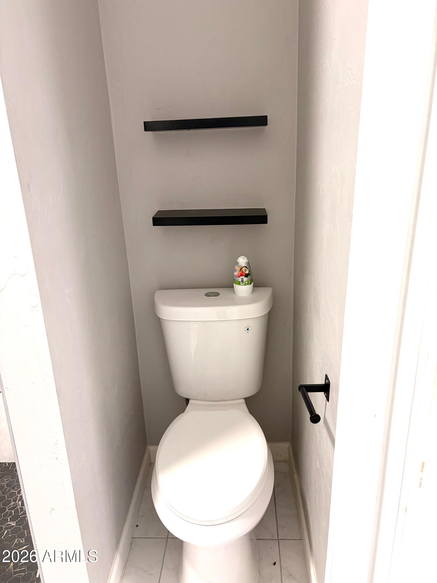 826 1st Street Douglas, AZ 85607 - Photo 16 of 35 a bathroom with a toilet and a sink