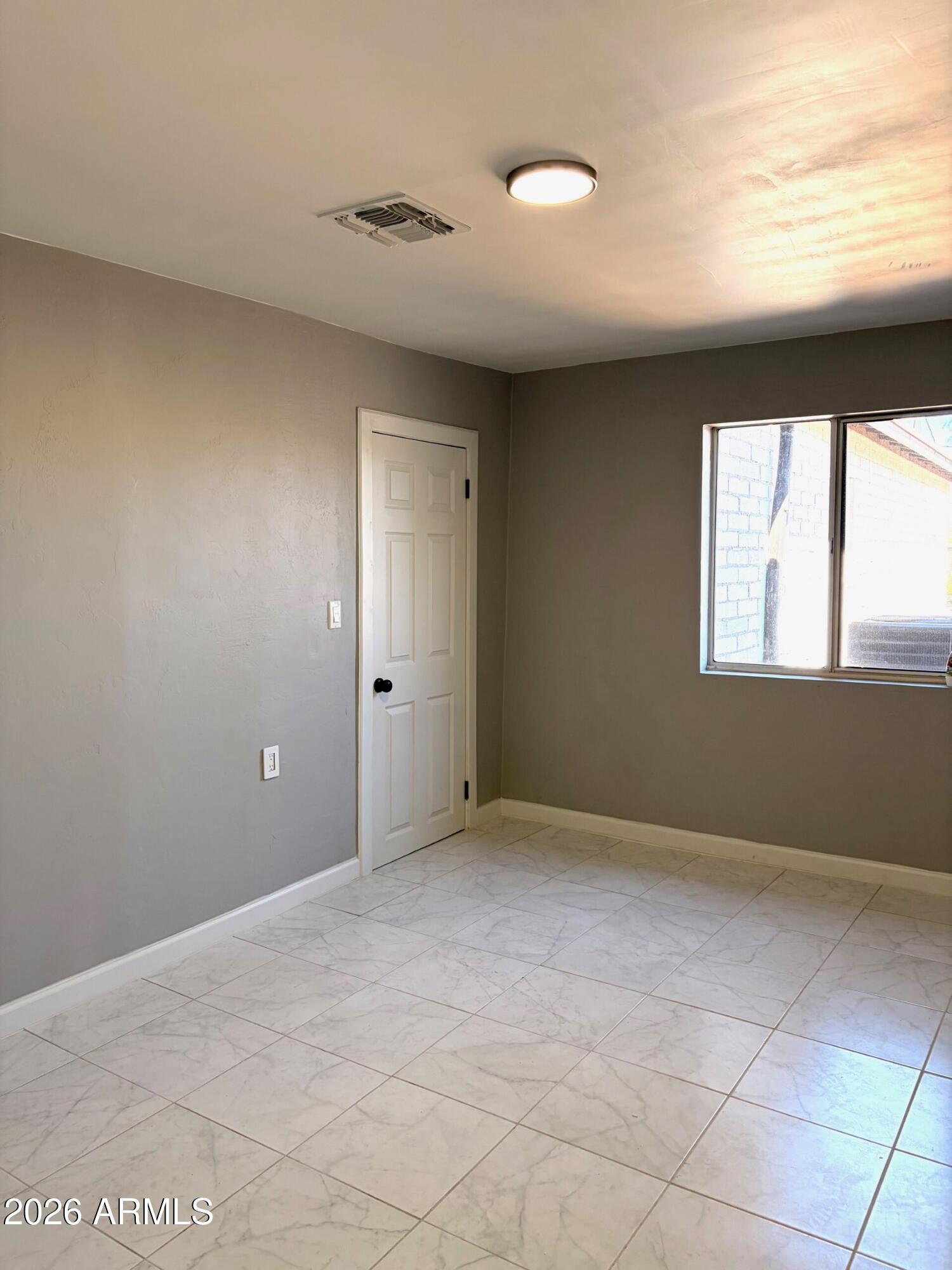 826 1st Street Douglas, AZ 85607 - Photo 29 of 35 a view of an empty room with a window