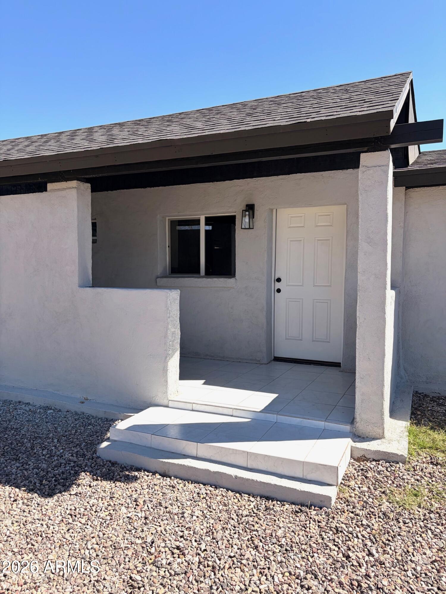 826 1st Street Douglas, AZ 85607 - Photo 4 of 35 a black and white wall with a potted plant