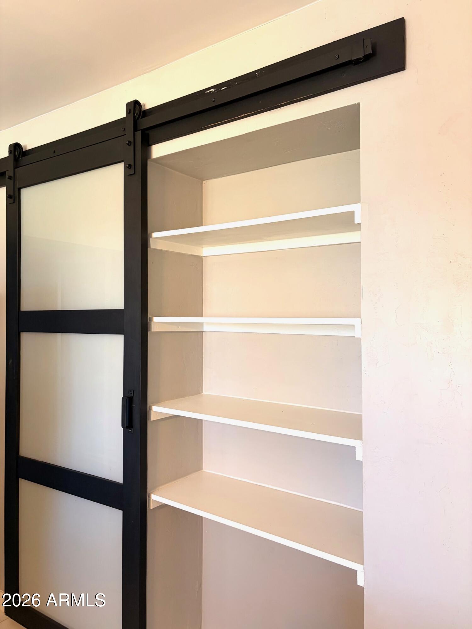 826 1st Street Douglas, AZ 85607 - Photo 8 of 35 a view of walk in closet with empty racks