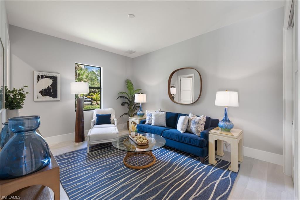 4221 7th Avenue Northwest Naples, FL 34119 - Photo 23 of 42 a living room with furniture