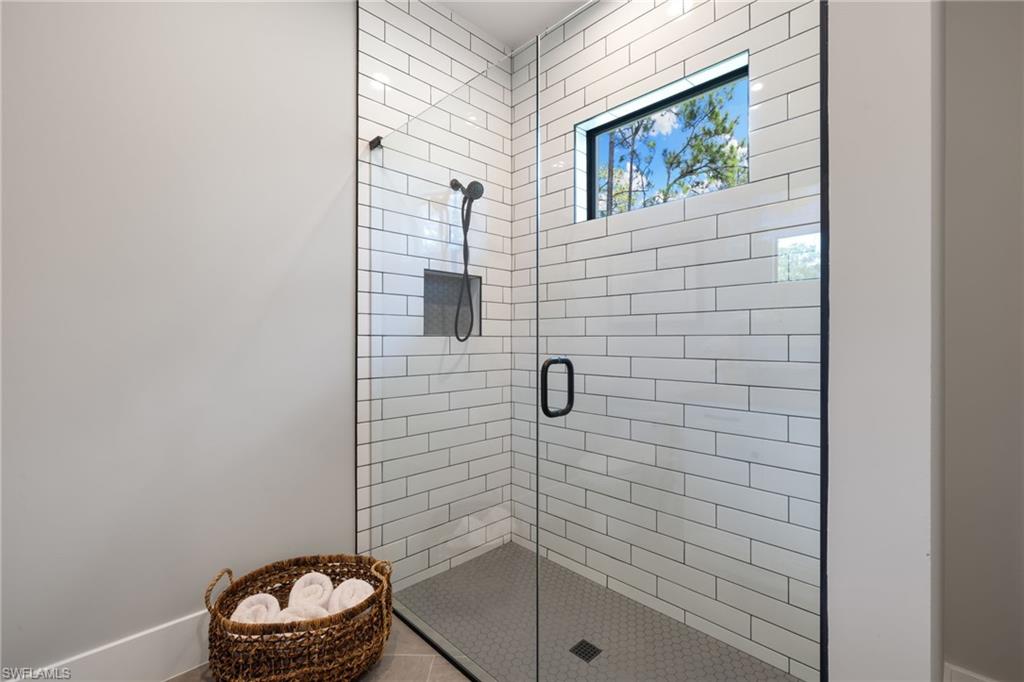 4221 7th Avenue Northwest Naples, FL 34119 - Photo 25 of 42 a bathroom with a toilet