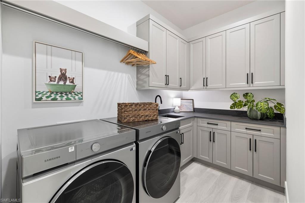 4221 7th Avenue Northwest Naples, FL 34119 - Photo 26 of 42 a utility room with sink dryer and washer