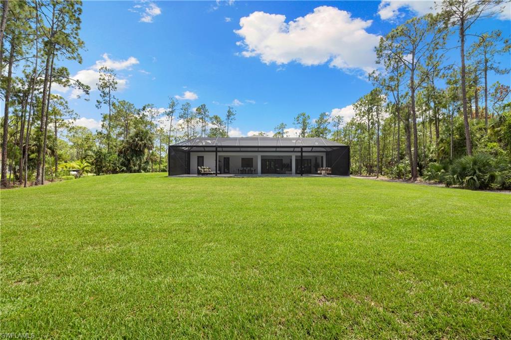 4221 7th Avenue Northwest Naples, FL 34119 - Photo 37 of 42 a view of a house with a big yard