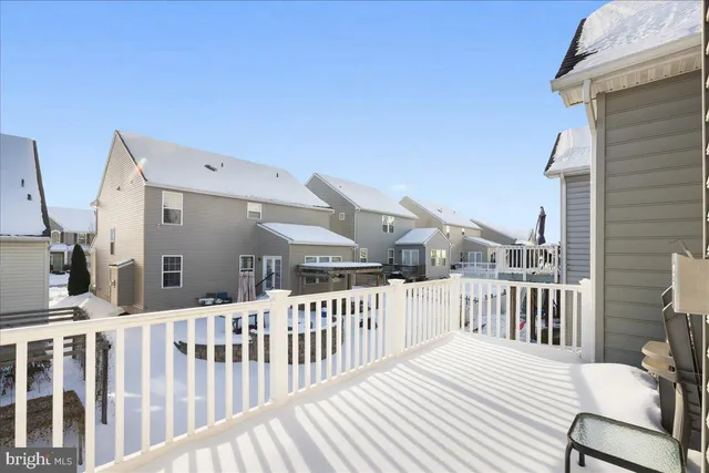 a view of a chair and table in the balcony
