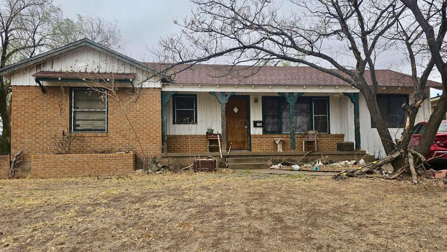 1820 Mustang Street Amarillo, TX 79102 - Photo 1 of 1 front view of a house with two chairs