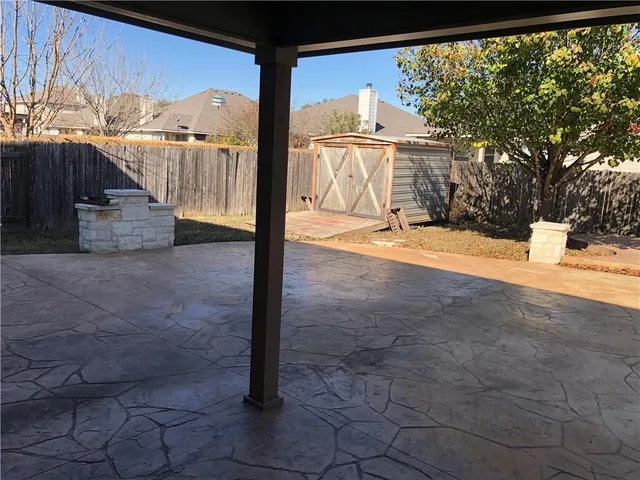 a view of a street with a building in the background