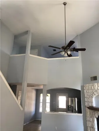 a view of a livingroom with furniture and staircase