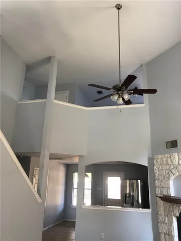 a view of a livingroom with furniture and staircase
