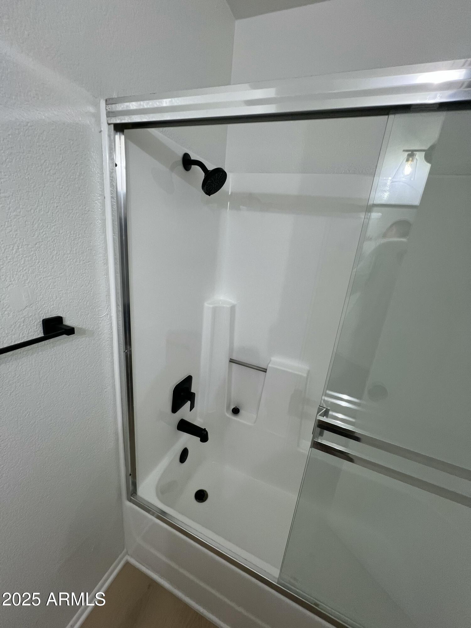 97 North Cooper Road, Unit 86 Chandler, AZ 85225 - Photo 9 of 16 a bathroom with a glass shower door