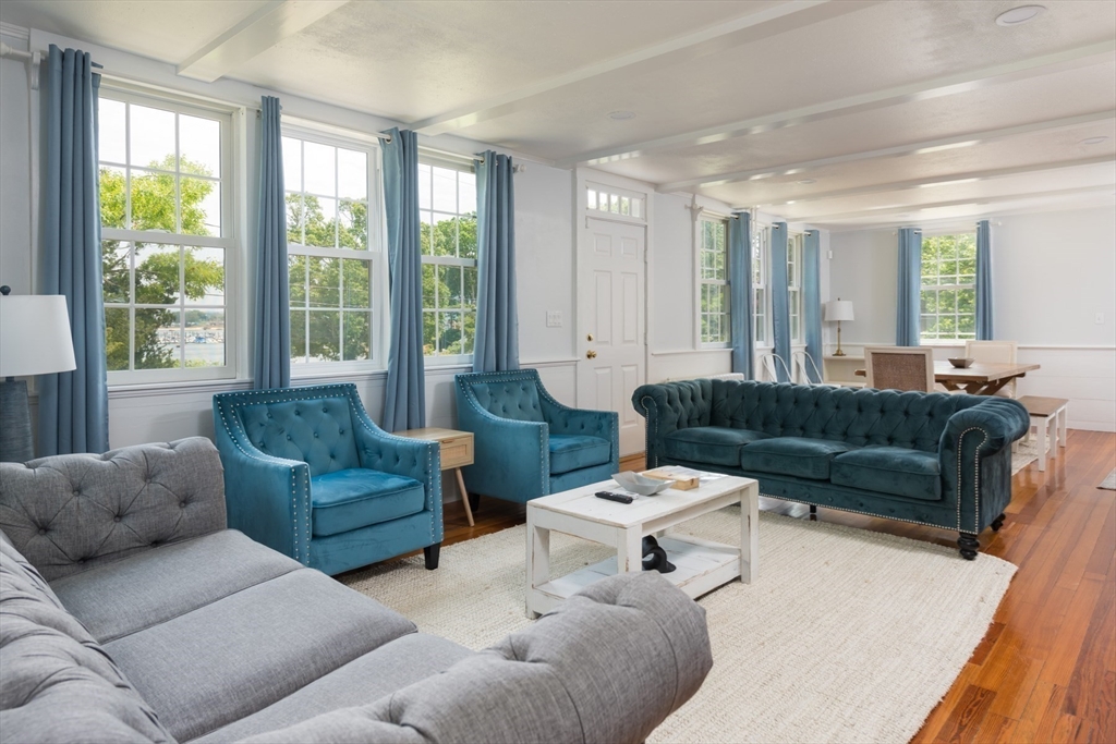 16 Jefferson Shores Road Wareham, MA 02532 - Photo 11 of 35 a living room with furniture and a large window