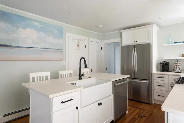 a kitchen with a sink and a refrigerator