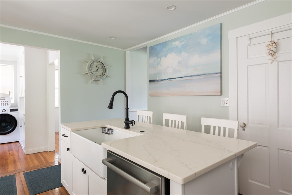16 Jefferson Shores Road Wareham, MA 02532 - Photo 20 of 35 a kitchen with a sink and a refrigerator
