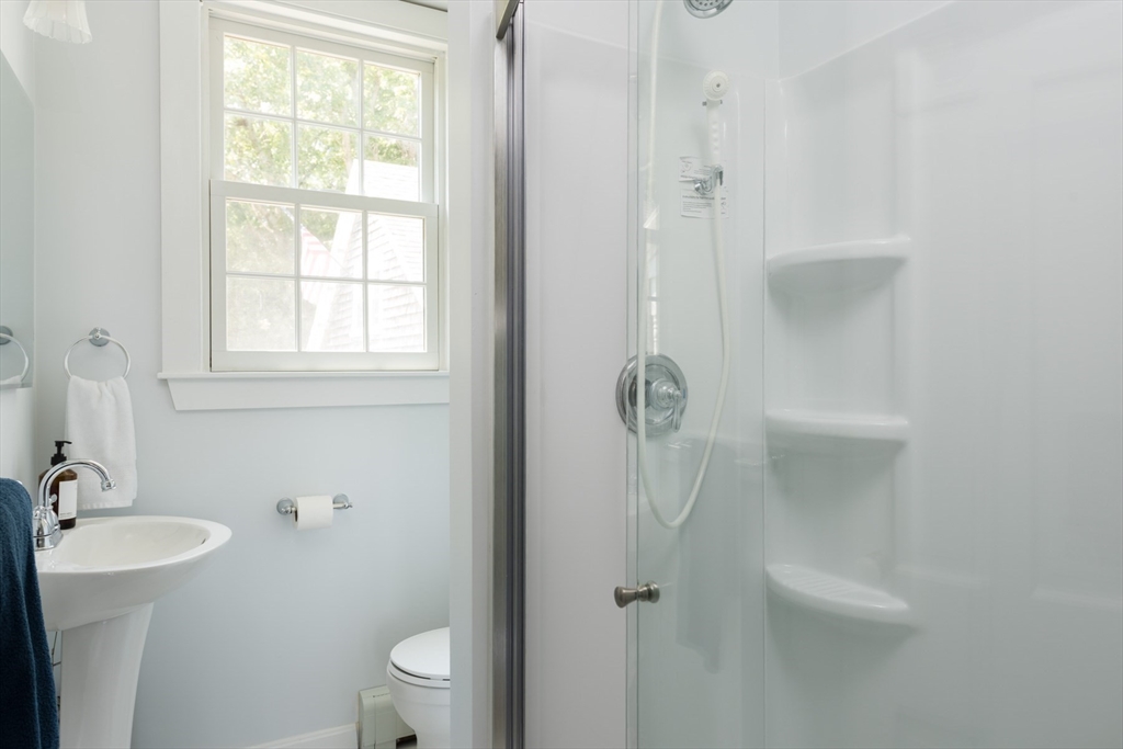 16 Jefferson Shores Road Wareham, MA 02532 - Photo 22 of 35 a bathroom with a sink a toilet and shower