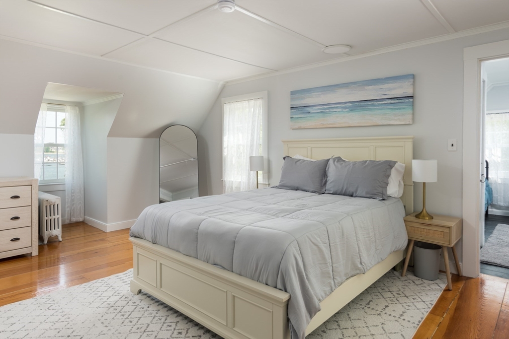 16 Jefferson Shores Road Wareham, MA 02532 - Photo 27 of 35 a bedroom with a bed and a mirror