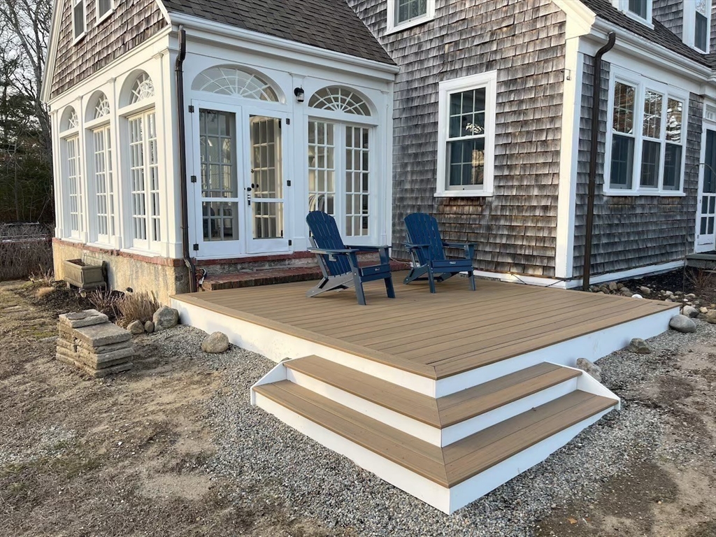 16 Jefferson Shores Road Wareham, MA 02532 - Photo 32 of 35 a view of a house with backyard and sitting area