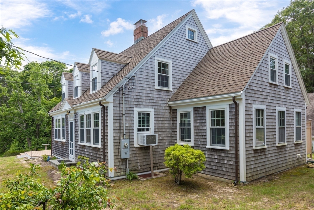 16 Jefferson Shores Road Wareham, MA 02532 - Photo 4 of 35 a view of a house with a yard and potted plants