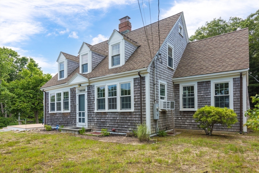 16 Jefferson Shores Road Wareham, MA 02532 - Photo 5 of 35 a view of a house with a yard and sitting area