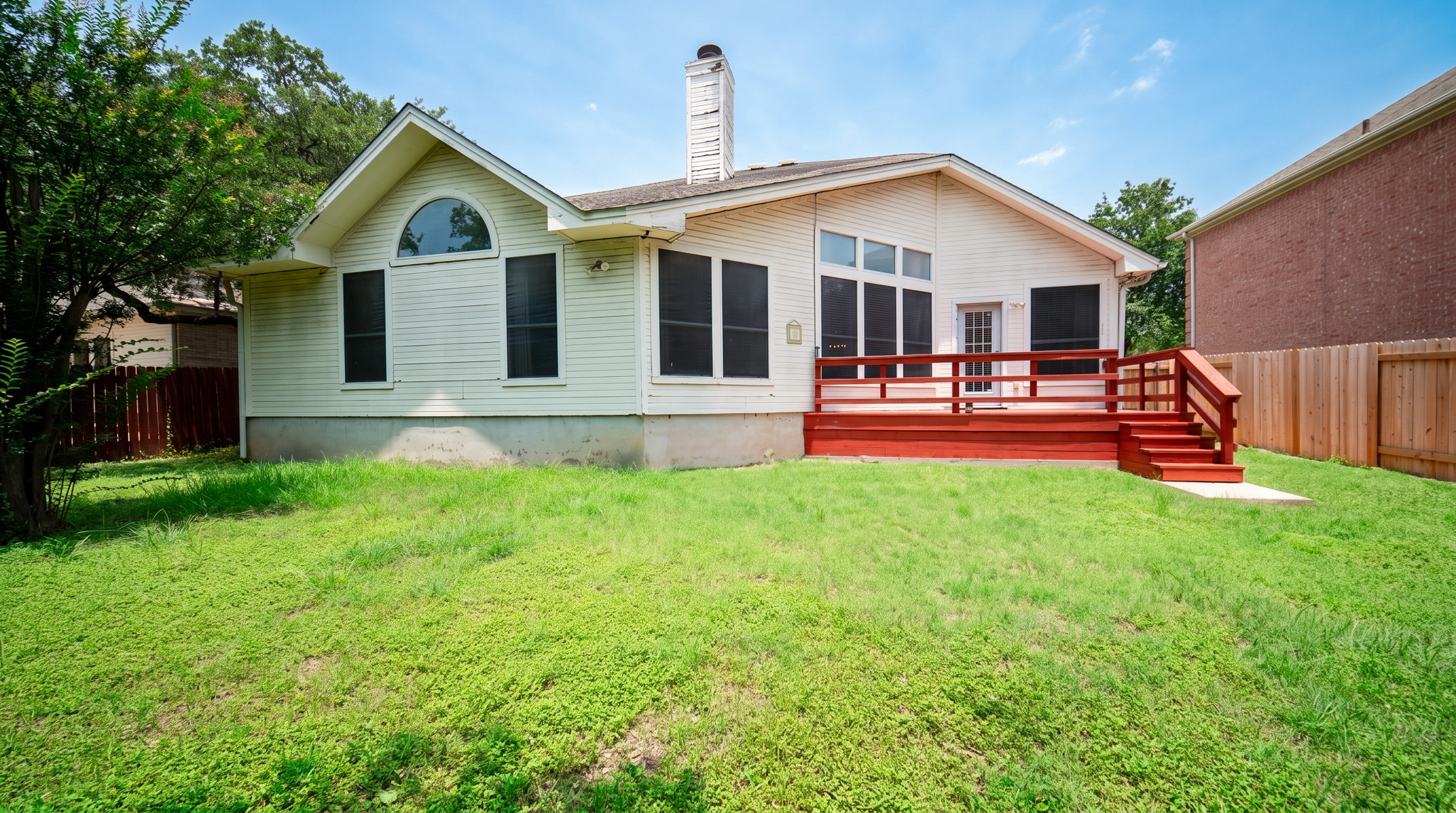 1108 Antelope Ridge Cedar Park, TX 78613 - Photo 15 of 27 A well-maintained wooden deck extends from the residence, overlooking a generously sized backyard.
