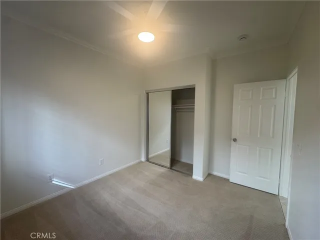 a view of an empty room and closet
