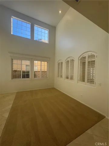 a view of an empty room with windows