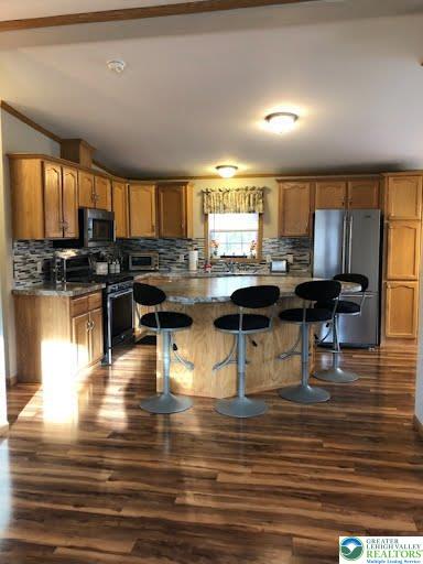 4905 Cedar Grove Road Bangor, PA 18013 - Photo 13 of 50 a kitchen with stainless steel appliances kitchen island granite countertop a stove and white cabinets