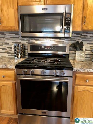 4905 Cedar Grove Road Bangor, PA 18013 - Photo 18 of 50 a stove top oven sitting inside of a kitchen
