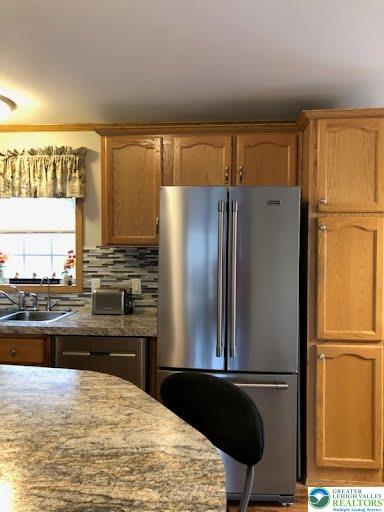 4905 Cedar Grove Road Bangor, PA 18013 - Photo 19 of 50 a kitchen with granite countertop a refrigerator and a sink