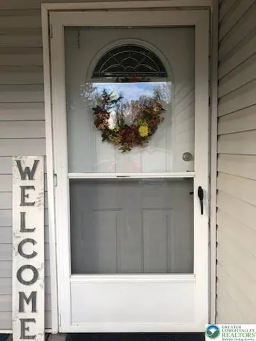 a view of a chairs and table on the deck