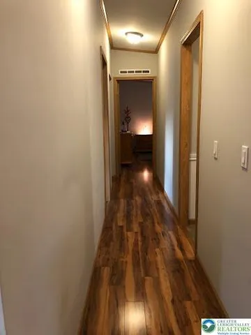 a bedroom with a bed and a mirror