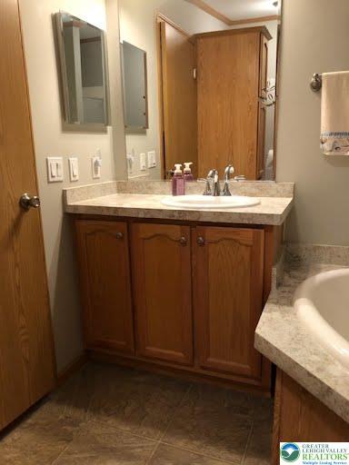 4905 Cedar Grove Road Bangor, PA 18013 - Photo 32 of 50 a bathroom with a sink and a mirror