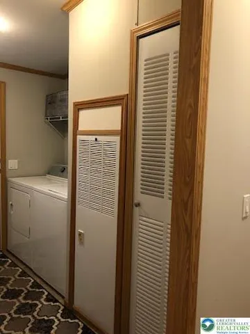 a view of hallway with wooden floor