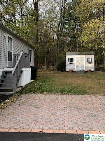 4905 Cedar Grove Road Bangor, PA 18013 - Photo 6 of 50 a white house that has a tree in front of it