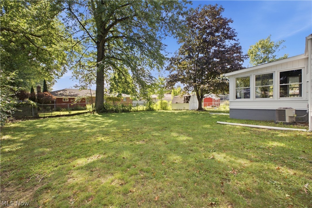 4845 New Road Austintown, OH 44515 - Photo 29 of 40 Expansive lawn area with mature trees and partial fencing