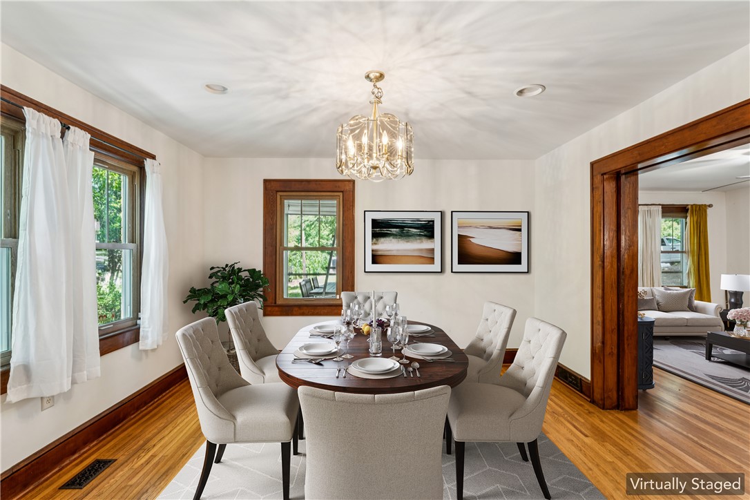 321 South Pine Street Walhalla, SC 29691 - Photo 5 of 32 Hardwood flooring and warm wood trim frame a spacious dining area, perfect for entertaining.