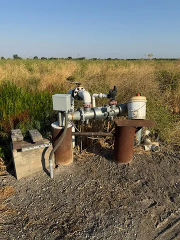 a view of a backyard with sitting area