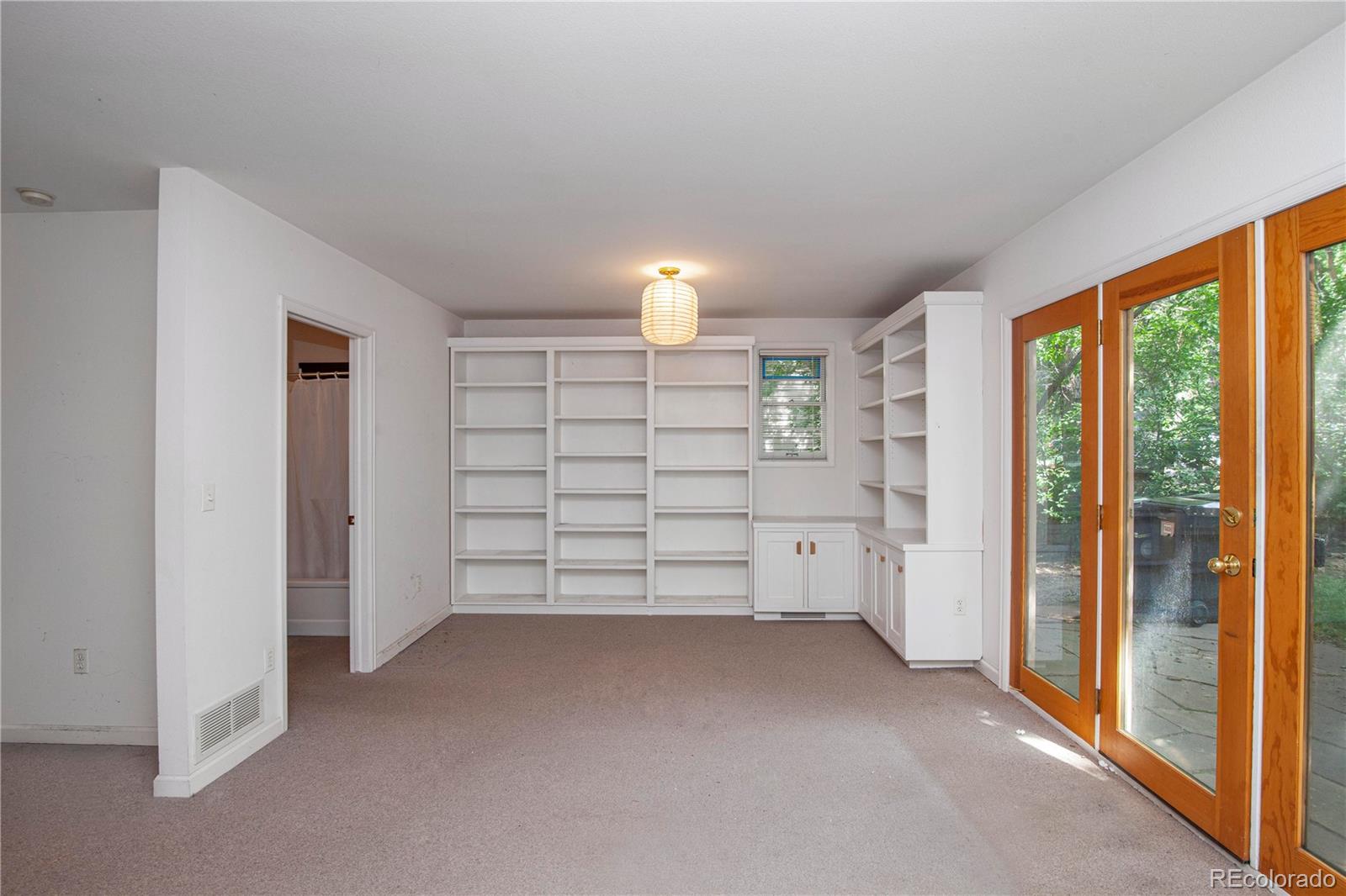 609 Pleasant Street Boulder, CO 80302 - Photo 15 of 28 a view of a room with a large window and chandelier