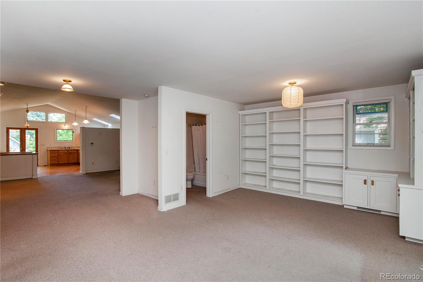 609 Pleasant Street Boulder, CO 80302 - Photo 16 of 28 a view of an empty room with a fireplace